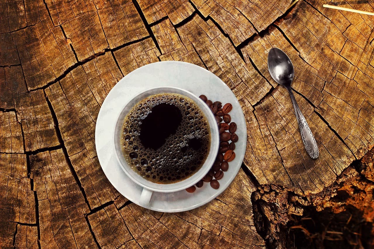A cup of black coffee on a saucer