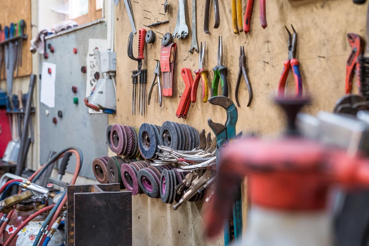 Hand tools hung on a workshop wall